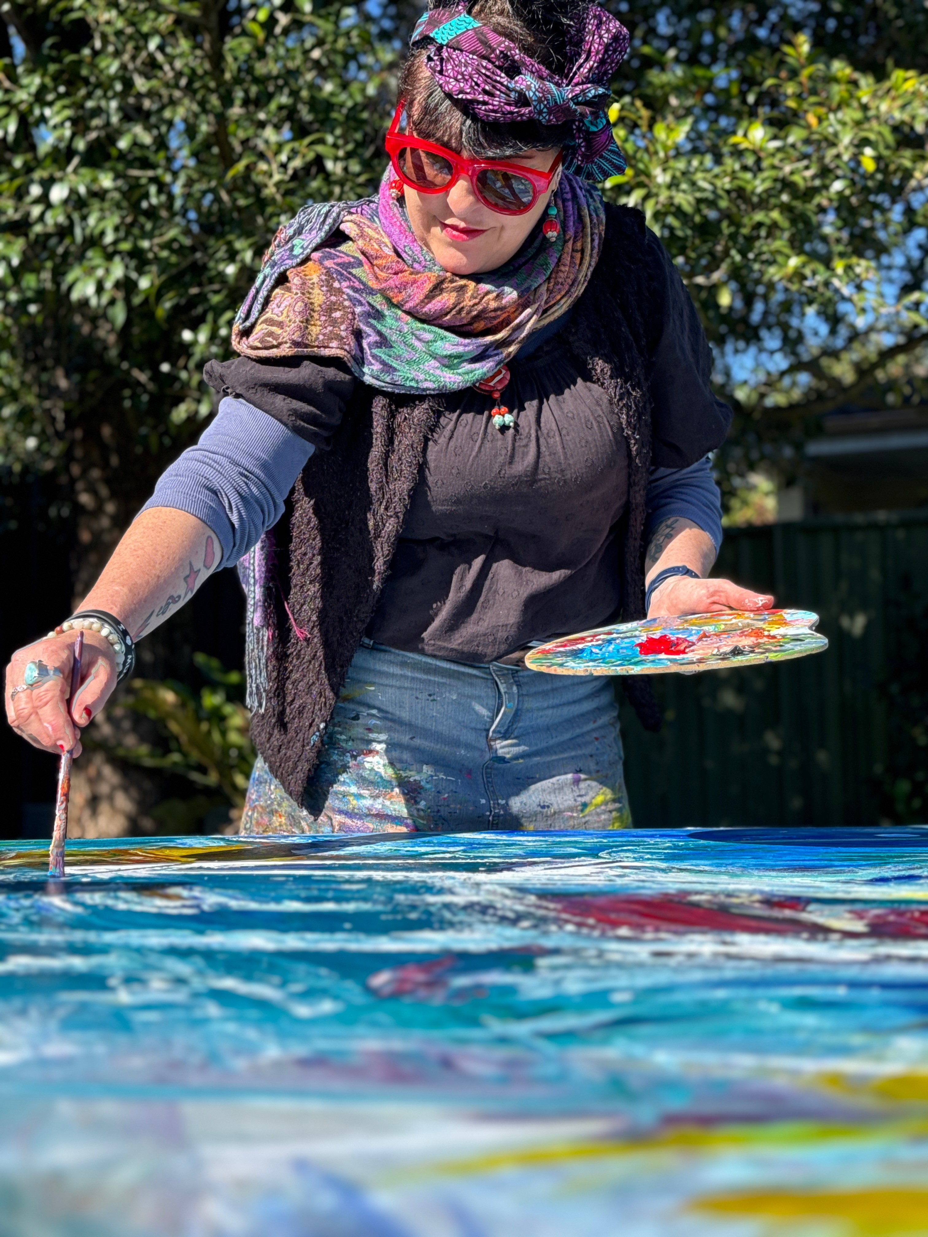 Woman with sunglasses walking down runway
